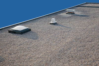 Inverted gravel roof chimney and skylight
